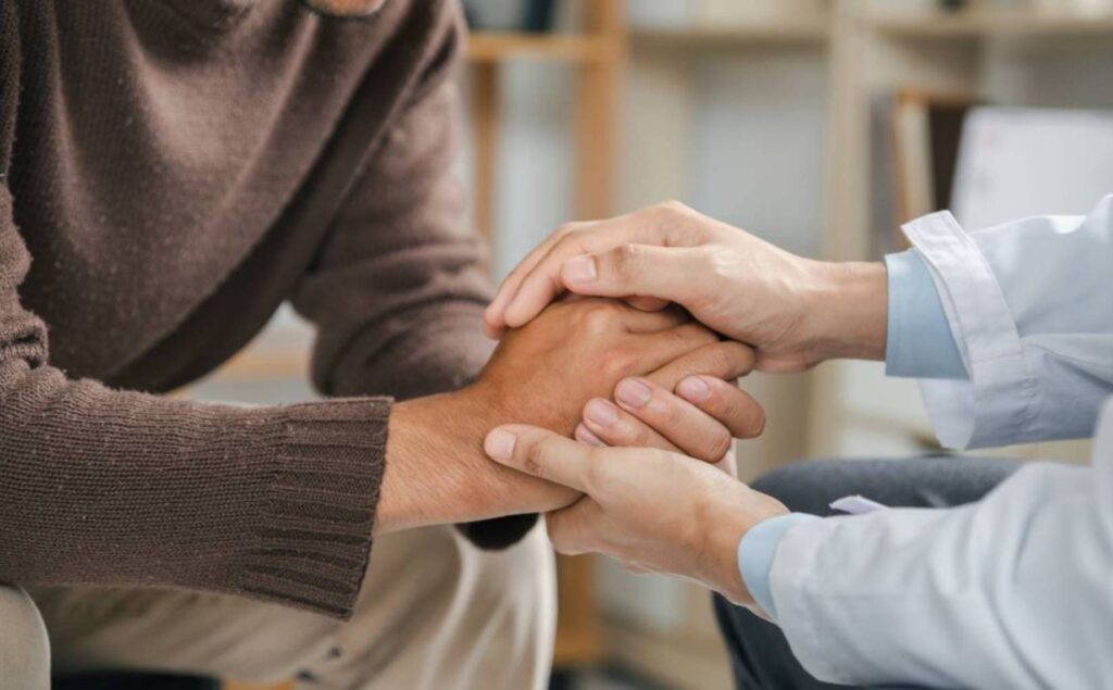 Man supported by therapist in individual therapy in Nashville.