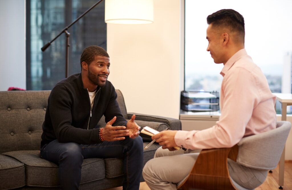 A man enjoys motivational interviewing during aftercare after completing stimulant addiction treatment in Nashville.