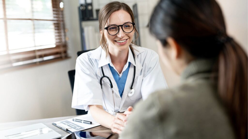 Doctor assisting a client at a Blue Cross Blue Shield rehab in Nashville.