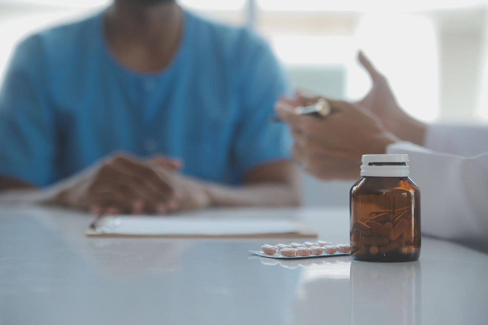 Doctor or physiotherapist working examining treating injured arm