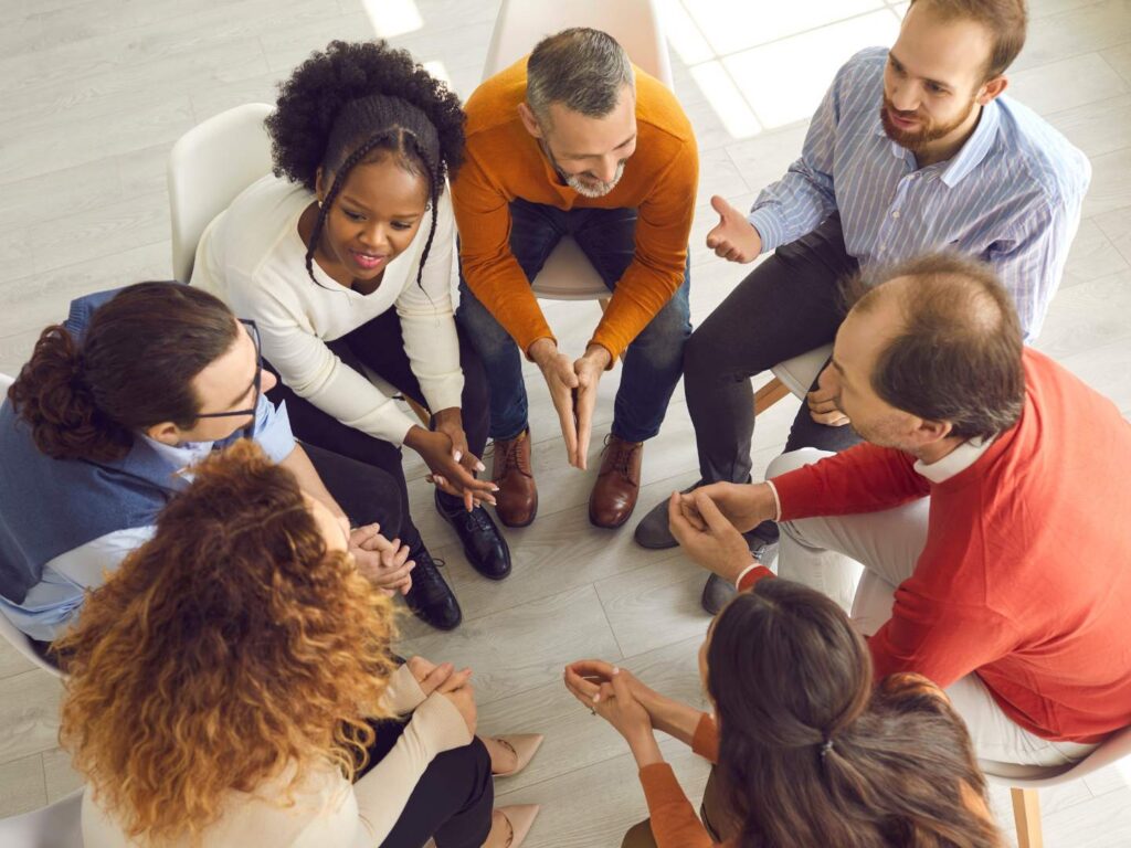 Professionals attending a group meeting at a professionals and executives rehab in Nashville.