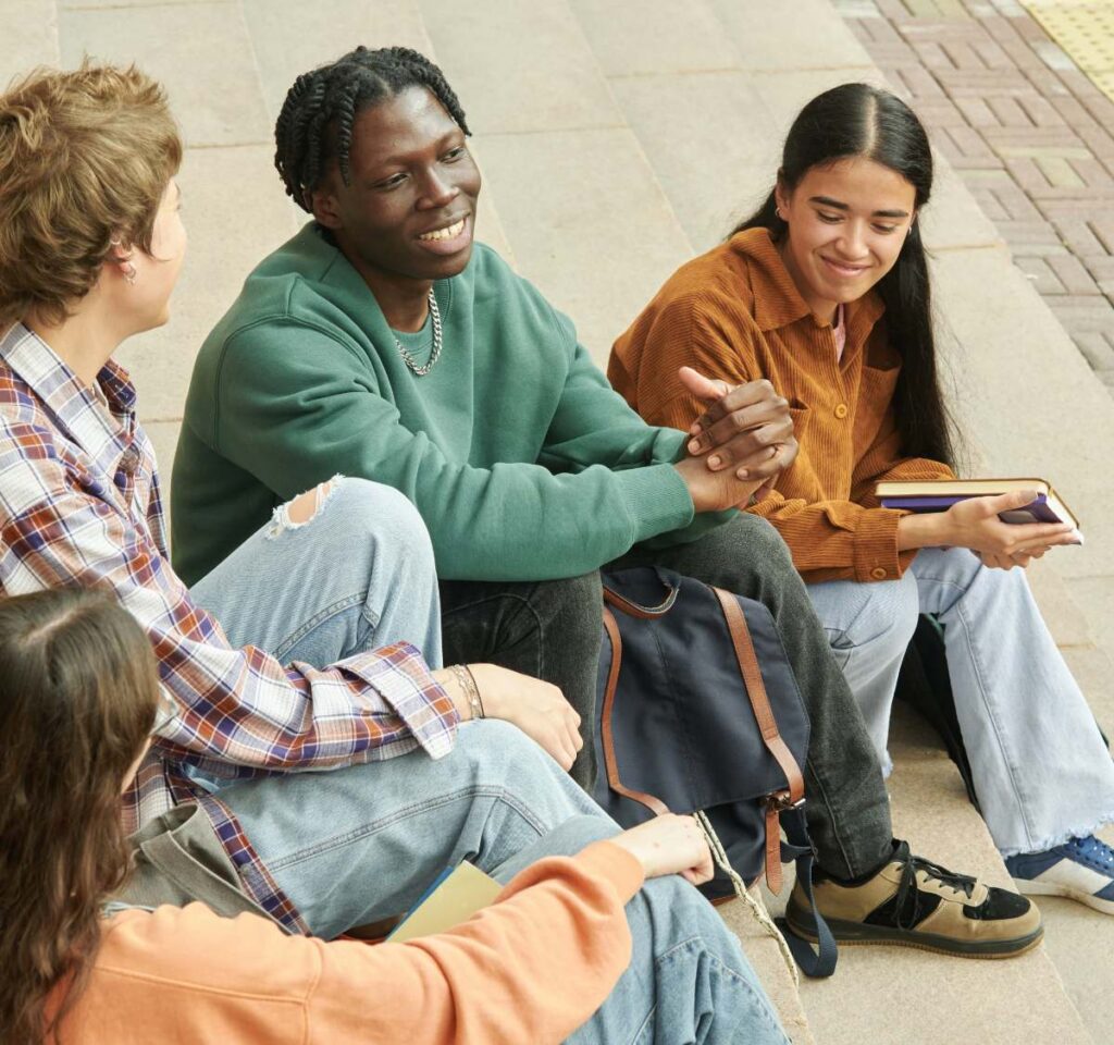 Group of teens having a conversation at a young adults rehab in Nashville.