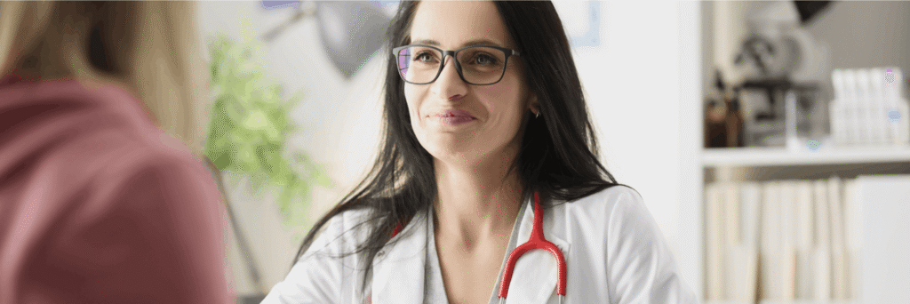 A doctor discusses treatment options with a client during rehab near Knoxville, TN.