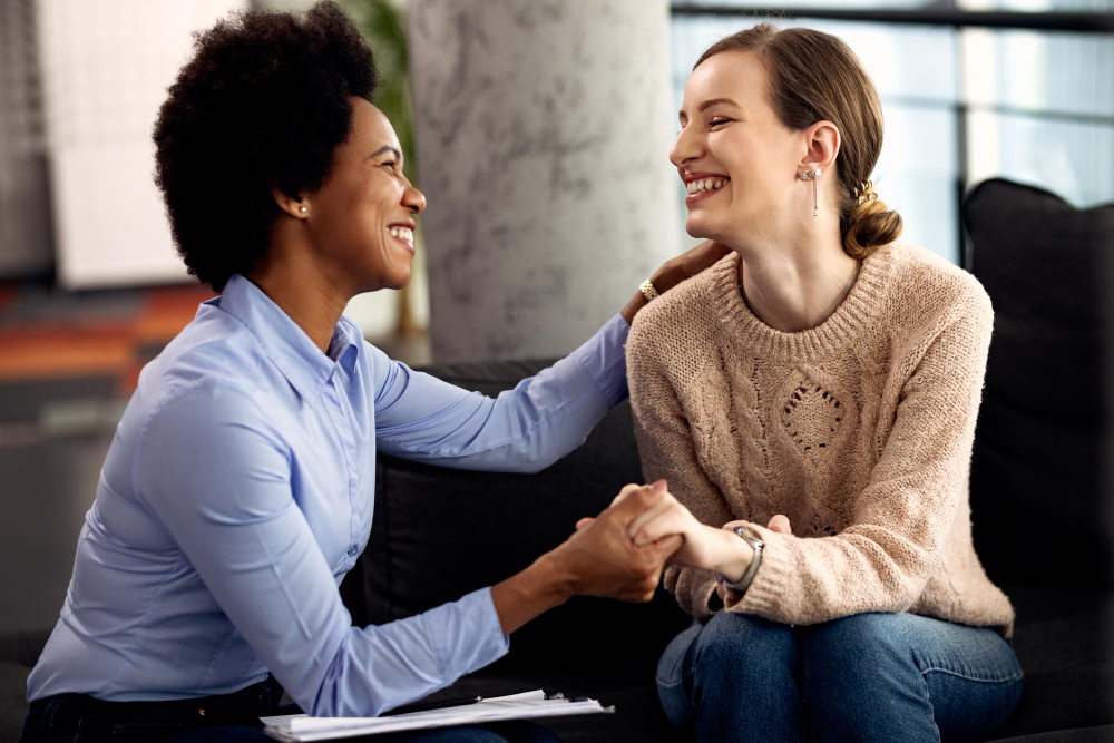 Supportive moment between therapist and client during PTSD treatment in Nashville.