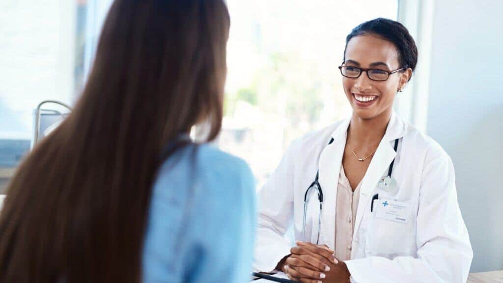 Doctor smiling while speaking with patient during MDMA addiction treatment in Nashville session