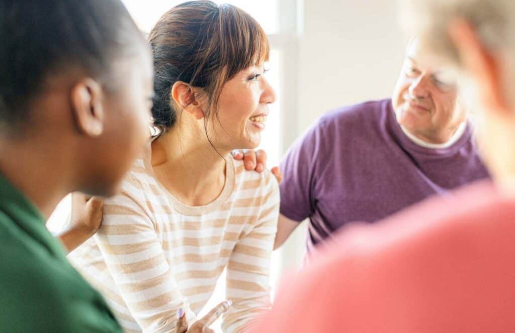 Woman attending a group therapy session focused on borderline personality disorder treatment in Nashville.