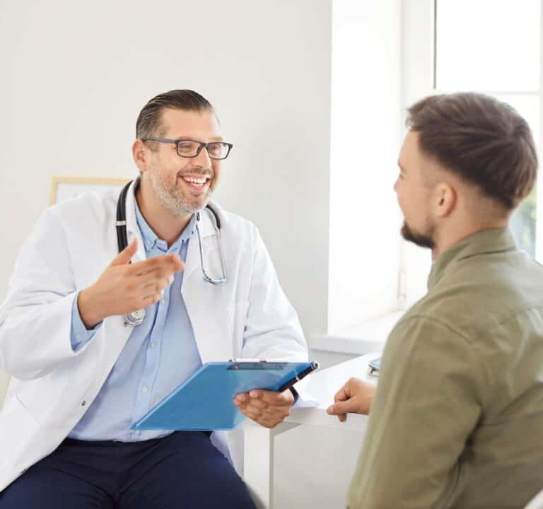Doctor speaking with a male client during hydrocodone addiction treatment in Nashville.