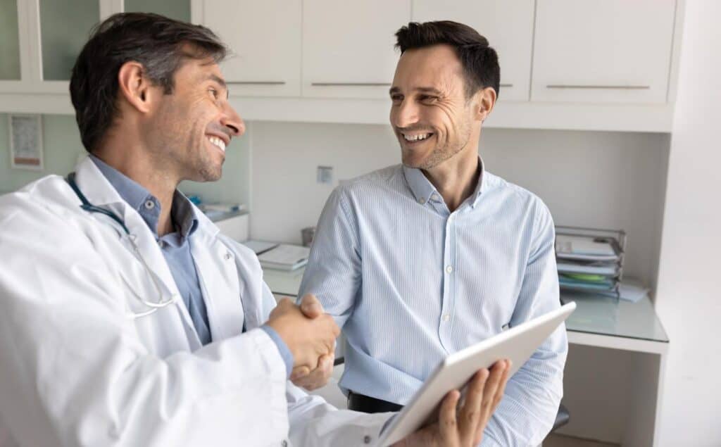 Man meeting with his doctor for hydrocodone addiction treatment in Nashville.