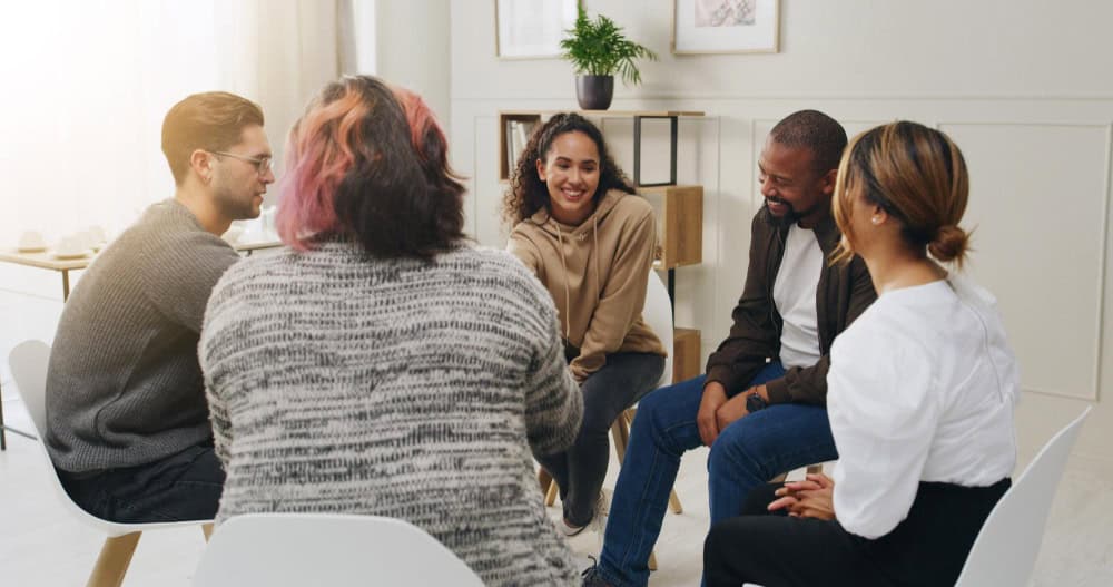 Adults participating in a supportive group counseling session focused on undiagnosed ADHD in adults.